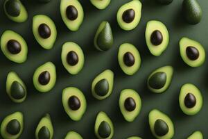 Fresh Avocado Halves Pattern on Green Background a Healthy Food Concept photo