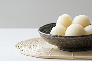 Japanese Mochi Rice Cake Balls Served in a Bowl on Table photo