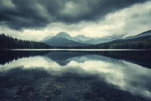 Reflecting Lake Scene with Mountains and Dramatic Sky Landscape photo