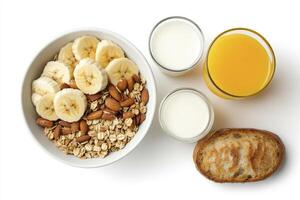Enjoying a Nutritious Breakfast Bowl with Banana, Milk, and Orange Juice photo