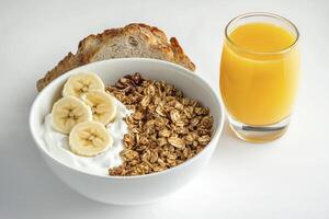 Enjoying Granola Bowl with Yogurt Banana Toast and Orange Juice photo