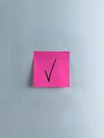 Vertical photo of check mark on sticky note to indicate your choice