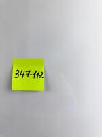Reminder on refrigerator with the phone number of person photo