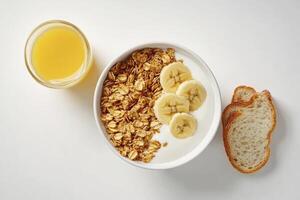 Enjoying a Healthy Breakfast of Granola Yogurt Banana and Orange Juice photo