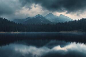 Lake Reflection of Mountains and Pine Forest Under Cloudy Moody Sky photo