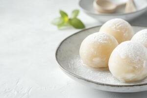 Mochi Balls with Powdered Sugar on Plate, Delicious Japanese Dessert photo