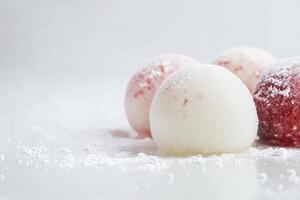 Colorful Mochi Ice Cream Balls with Powdered Sugar for Dessert photo