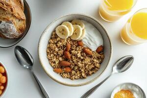 Enjoying a Delicious and Nutritious Granola Breakfast with Fruit and Juice photo