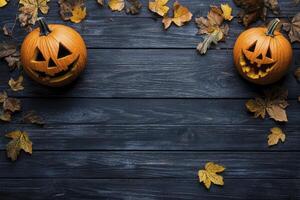Two jack o lantern pumpkins on a dark wooden background photo
