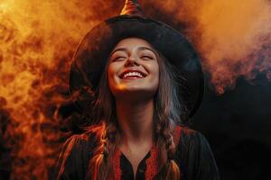 Smiling Witch in Costume Posing with Eyes Closed in Smoky Background photo