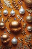Arrangement of Christmas Ornaments and Decorations on Warm Orange Background photo