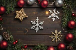 Arrangement of Christmas Ornaments and Snowflakes on Rustic Wooden Background photo
