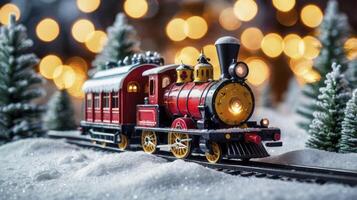 Toy Train on Tracks with Winter Snow and Christmas Lights Background photo