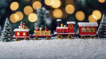 Festive Toy Train on Snow with Christmas Tree and Bokeh Lights photo