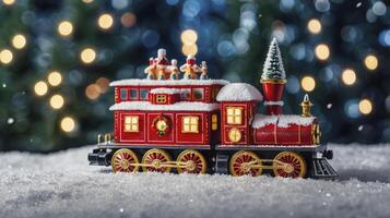 Toy Christmas Train in Snow with Festive Tree and Holiday Lights photo