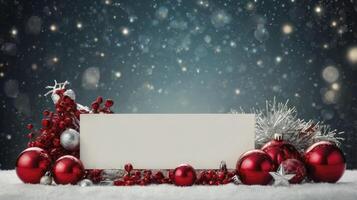 Festive Christmas Ornament Arrangement with Blank Card and Snowy Background photo