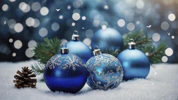 Blue christmas balls with snow and pine cones photo