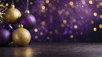 Elegant Christmas Ornaments on Dark Surface with Purple and Gold Bokeh photo
