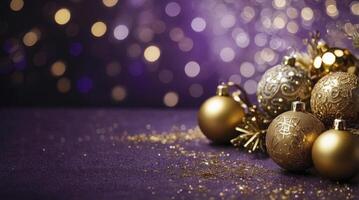 Festive Holiday Ornaments on Purple Background with Golden Glittering Details photo