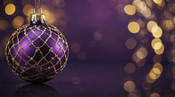 Elegant Purple Christmas Ornament with Golden Details on Festive Bokeh Background photo