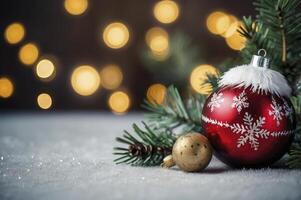 Christmas Ornament and Pine Sprig on Snowy Surface with Bokeh Lights photo