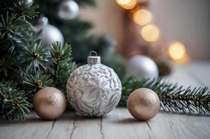 Decorating Christmas Tree with Silver and Gold Baubles on Wooden Table photo