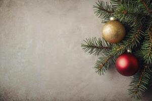 Christmas Tree Branch with Red and Gold Ornaments on Textured Background photo