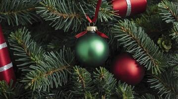 Hanging Christmas Ornaments on Fir Tree Branches for Festive Decoration photo