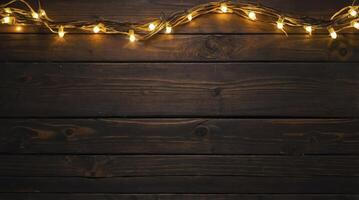 Rustic Wooden Background with Glowing String Lights for Festive Atmosphere photo