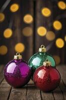 Christmas Ornaments Still Life with Bokeh Lights on Rustic Wood Surface photo