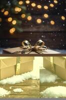 Present with Gold Ribbon and Christmas Lights in a Snowy Scene photo