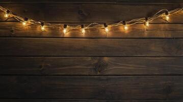 String Lights Glowing on Rustic Dark Wood Background for Festive Occasions photo