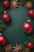 Christmas Ornaments and Greenery Frame on Dark Green Background photo