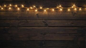 String Lights Illuminating a Dark Wooden Wall Background for Celebrations photo