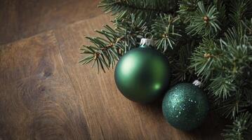 Christmas Ornaments with Fir Branch on Wooden Surface Holiday Theme photo