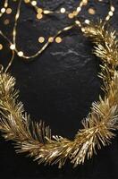 Golden Garland and Lights Decorating a Dark Surface for the Holidays photo