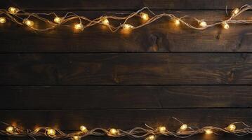 String Lights Decorating a Dark Wood Plank Background for Festive Occasion photo