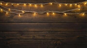 Illuminated String Lights on Dark Wood Background for Festive Decoration photo