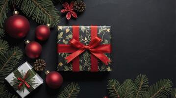 Christmas gifts on a black background with red ribbon photo
