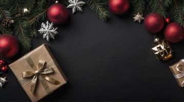 Arrangement of Christmas Gifts and Ornaments on a Black Background photo