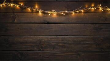 Glowing String Lights on a Dark Wood Surface for Holiday Backdrop photo