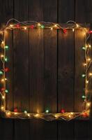 Festive Lights Frame on Wood Background for Holiday Message photo