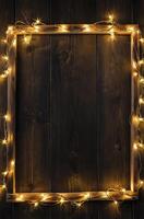 Wooden Frame Lit by String Lights on Dark Wood Background photo