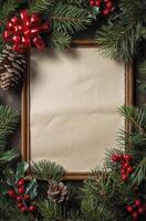 Christmas Frame with Blank Paper Surrounded by Pine Cones and Berries photo