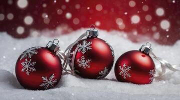 Festive Red Christmas Ornaments Displayed on Fresh Snow with Bokeh Lights photo