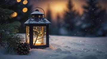Illuminated Lantern in Winter Snow Scene with Pine Cone photo