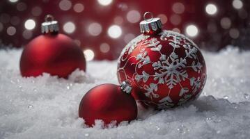 Festive Red Christmas Ornaments Resting in Snow with Bokeh Lights Background photo