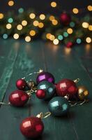 Festive Christmas Ornament Arrangement on Wood with Bokeh Lights Background photo