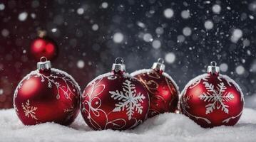 Red Christmas Ornaments on Snow with Falling Snow Background photo