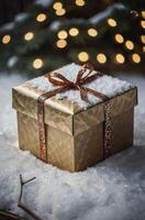 Present in Snowy Landscape with Gold Ribbon and Christmas Tree Lights photo